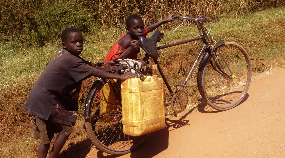 Children pushing a bike